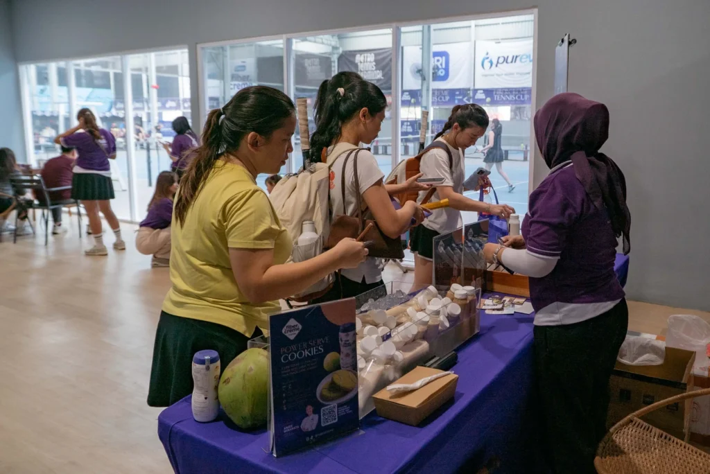 Participants and Visitors of FiberCreme Tennis Cup 2026 redeem vouchers for food and drinks